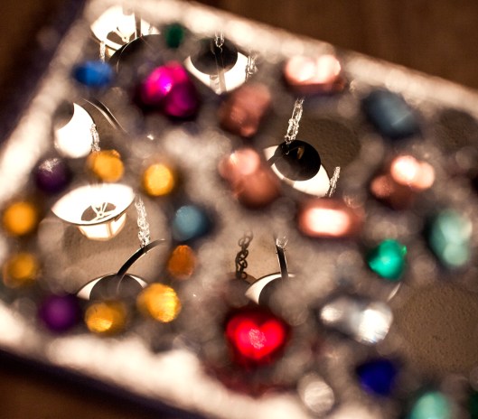 The dining room light is visible in the mirrors on the notebook cover.