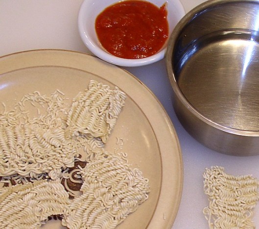 Break off a section of Ramen Noodles to use for the tiny spaghetti