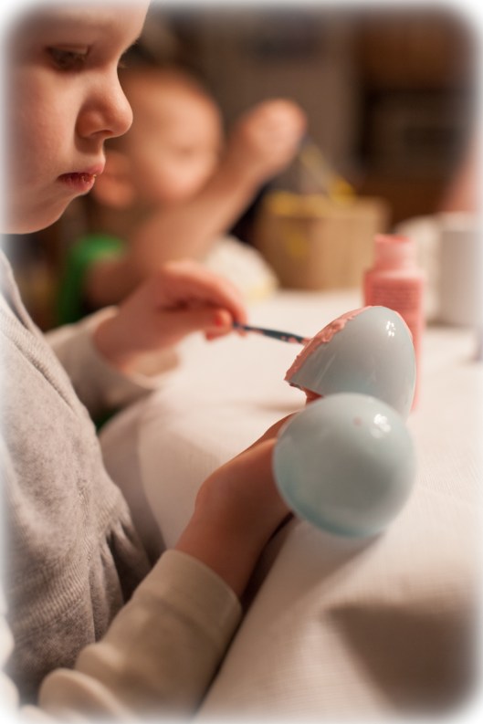 Painting the plastic Easter Eggs.