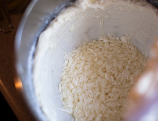 Unsalted butter and egg whites are beaten together for the first part of mixing the batter. I took this photo just because I loved how the slippery butter bits swooshed around the bowl of egg whites.