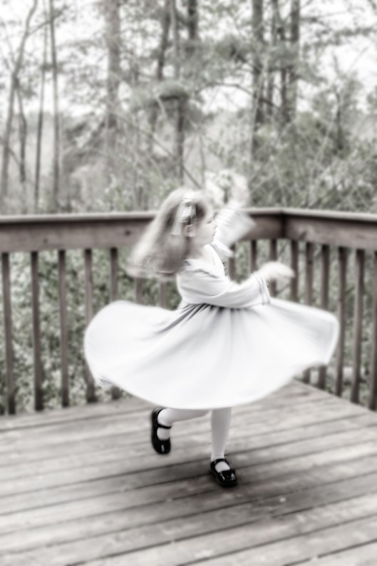 My granddaughter spins  in her Spinning Tales dress.