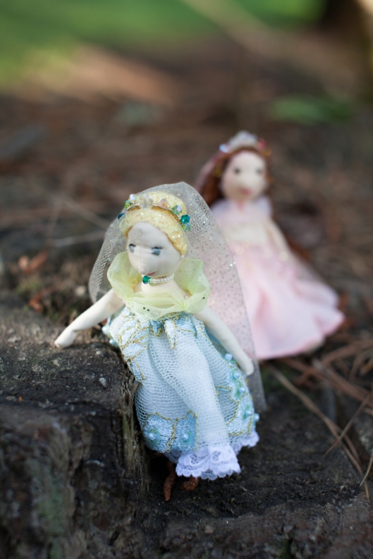 Two tiny princess dolls, ready to begin their adventures.