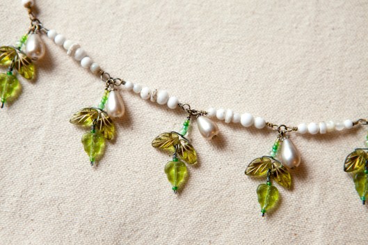 The sections of white beads are attached and the leaf clusters have been added. I love the bracelet just the way it is here! 