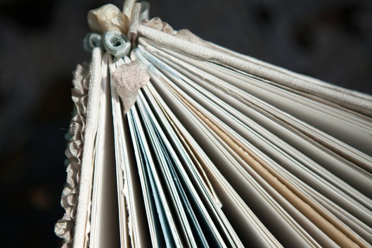 One of the ribbons at the spine is used as a bookmark.