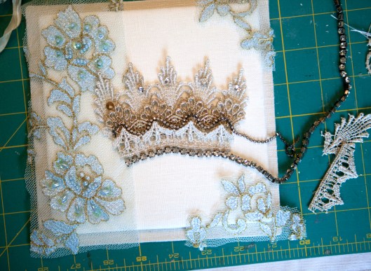 Trying out pieces of lace for the crown.