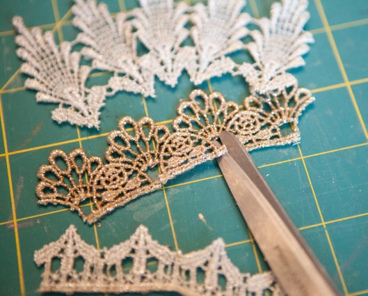 Snipping the lace so it curves better. 