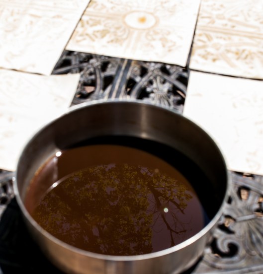 The day was bright and dry when I dyed  the wrought iron style paper. The  large pan of coffee dye was wide enough for the paper to fit comfortably.  