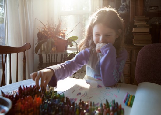 My granddaughter picks colors to test before drawing in her sketchbook.