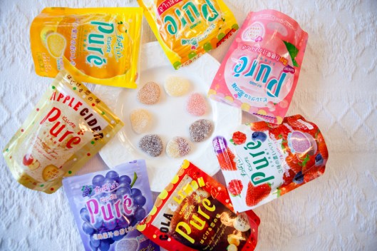 Clockwise from the pink package: Peach, Mixed Berry, Cola, Grape, m, Lemon, Citrus. 