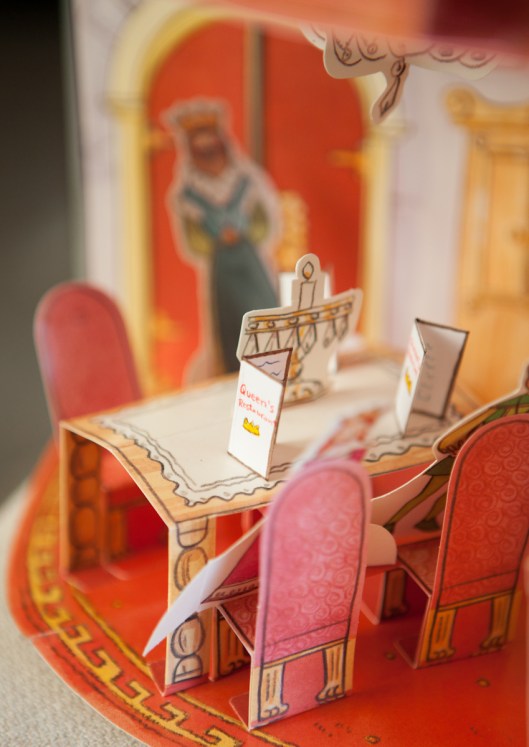 At the Queen's Restaurant, the table glowed from the light of the beautiful chandelier and candle on the table.