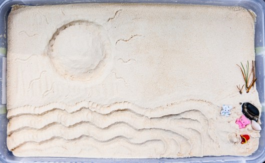 Pink Bear and Spotted Bear in the sand box, thinking of the beach!