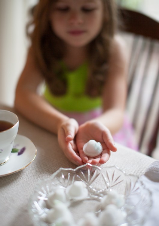 My granddaughter hold a little Sugar Bonnet before dropping it in her tea.