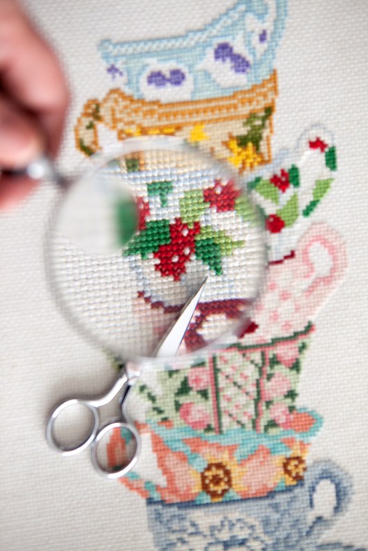 Teacups cross stitch - the red was too bright so I cut out all the stitches.