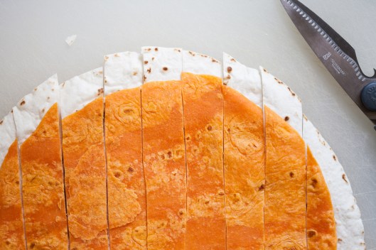 Strips of white Mission flour tortilla and orange Habanero Lime tortilla.