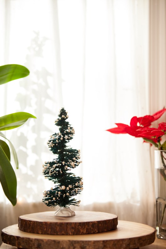 Pearl Bottle Brush Tree Topiary, made by cutting bristles out of a bottle brush tree and gluing on pearls.