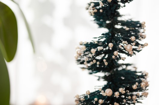 Pearls are glued to the tips of bristles on this Bottle Brush Topiary Tree.