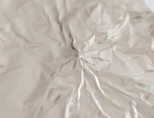 The foil is gently pressed down around the bead to create a little mound. 